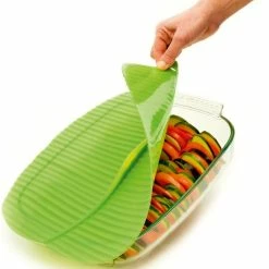 Charles Viancin Silicone Banana Leaf Baking Lid - Square, 10" X 10" -Cuisinart Sales Shop charles viancin banana leaf baking cover action shot compressed
