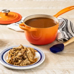 Le Creuset 1.75 Qt. Signature Enameled Cast Iron Saucepan With Stainless Steel Knob | Flame Orange -Cuisinart Sales Shop flame