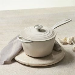 Le Creuset 2.25 Qt. Signature Enameled Cast Iron Saucepan With Stainless Steel Knob | Meringue White -Cuisinart Sales Shop mer1 1